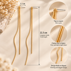 Boucles d’oreilles longues dorées à double chaîne sur pierre beige